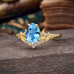Nature and Moon-Inspired 4-Prong Pear-Cut Aquamarine Engagement Ring