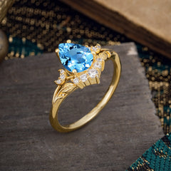 Nature and Moon-Inspired 4-Prong Pear-Cut Aquamarine Engagement Ring