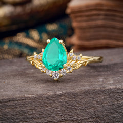 Nature and Moon-Inspired 4-Prong Pear-Cut Emerald Engagement Ring