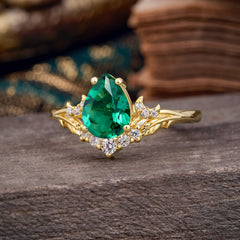 Nature and Moon-Inspired 4-Prong Pear-Cut Emerald Engagement Ring