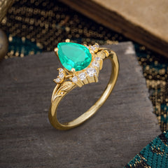 Nature and Moon-Inspired 4-Prong Pear-Cut Emerald Engagement Ring