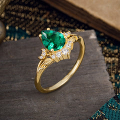 Nature and Moon-Inspired 4-Prong Pear-Cut Emerald Engagement Ring