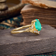 Nature and Moon-Inspired 4-Prong Pear-Cut Emerald Engagement Ring