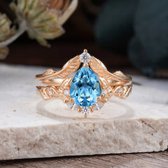 Nature-Inspired 3-Prong Tear-Cut Aquamarine Engagement Ring Set