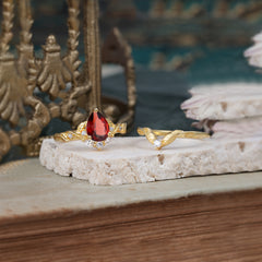 Nature-Inspired 3-Prong Tear-Cut Garnet Engagement Ring Set