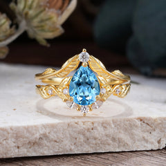 Nature-Inspired 3-Prong Tear-Cut Aquamarine Engagement Ring Set