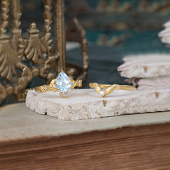 Nature-Inspired 3-Prong Tear-Cut Aquamarine Engagement Ring Set