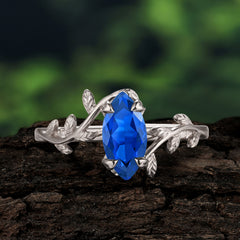 Nature-Inspired Leafy Branch 4-Prong Marquise Sapphire Engagement Ring