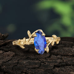 Nature-Inspired Leafy Branch 4-Prong Marquise Sapphire Engagement Ring