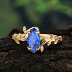 Nature-Inspired Leafy Branch 4-Prong Marquise Sapphire Engagement Ring