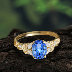 Luxury Vintage Haute Nature 4-Prong Oval Sapphire Ring