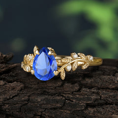 Nature-Inspired Vine-Entwined 4-Prong Teardrop-Cut Sapphire Engagement Ring