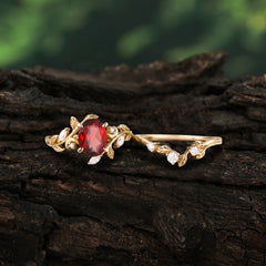 1.15 CT Delicate Leaf Accented 4 Prong Oval Shaped Garnet Ring Sets