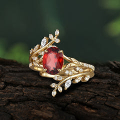Delicate Leaf Embellished 4 - Prong Oval - Cut Garnet Ring Sets
