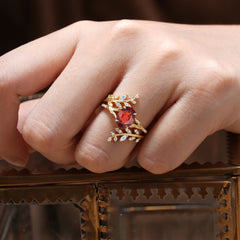 Delicate Leaf Embellished 4 - Prong Oval - Cut Garnet Ring Sets