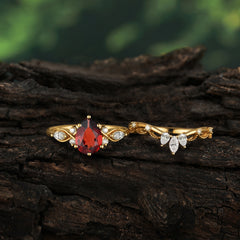 6 Prong Romantic Vine Themed Pear Cut Garnet Rings